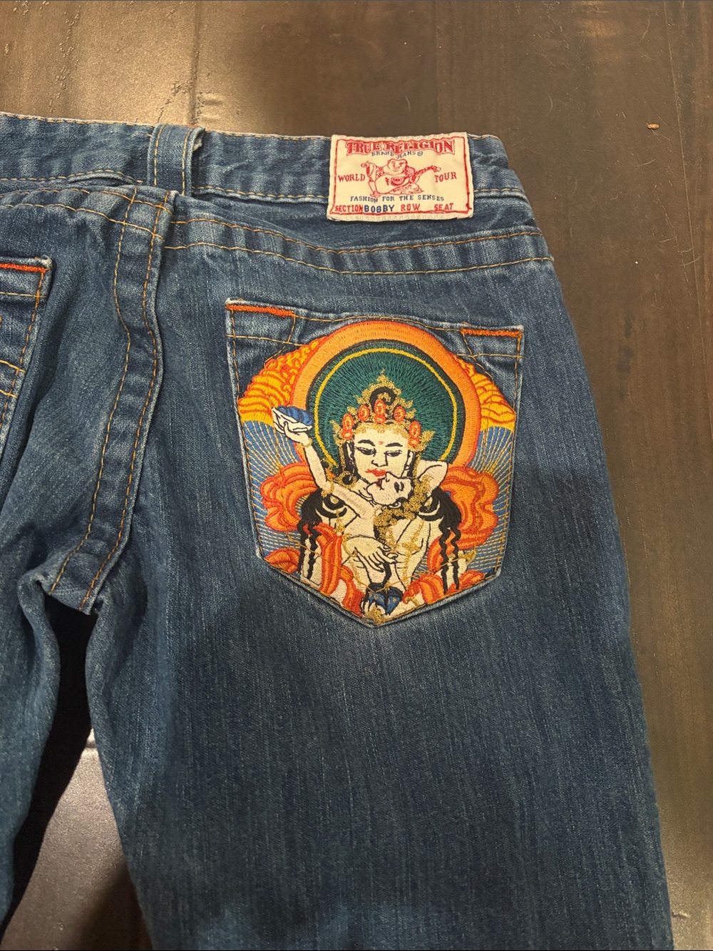 True Religion Blue Denim Flare Jeans with Embroidered Pocket Artwork